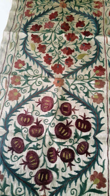 Suzani hand-embroidered silk fabric with pomegranade