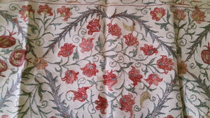 Suzani hand-embroidered silk fabric with pomegranade