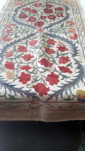 Suzani hand-embroidered silk fabric with pomegranade