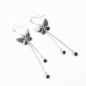 Silver butterfly-shaped earrings from Uzbekistan